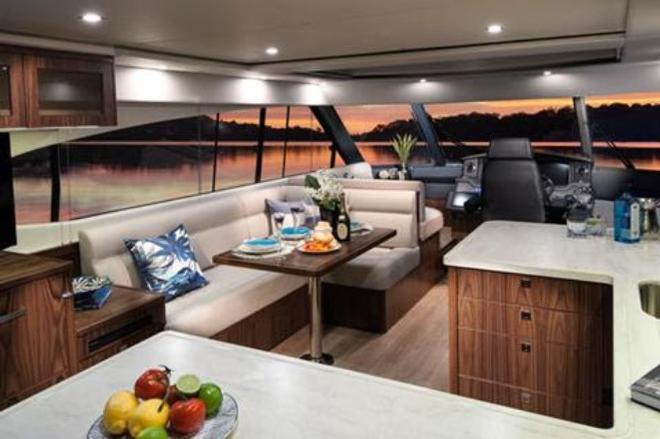 The luxurious saloon of the 5400 Sport Yacht from Riviera offers a remarkable volume of space, as well as panoramic vistas through her large windows. © Riviera Australia